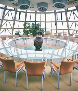 Conference hall with round table and chairs